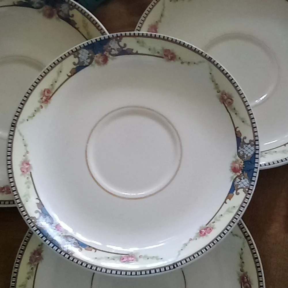 4 vintage camwood ivory saucers
